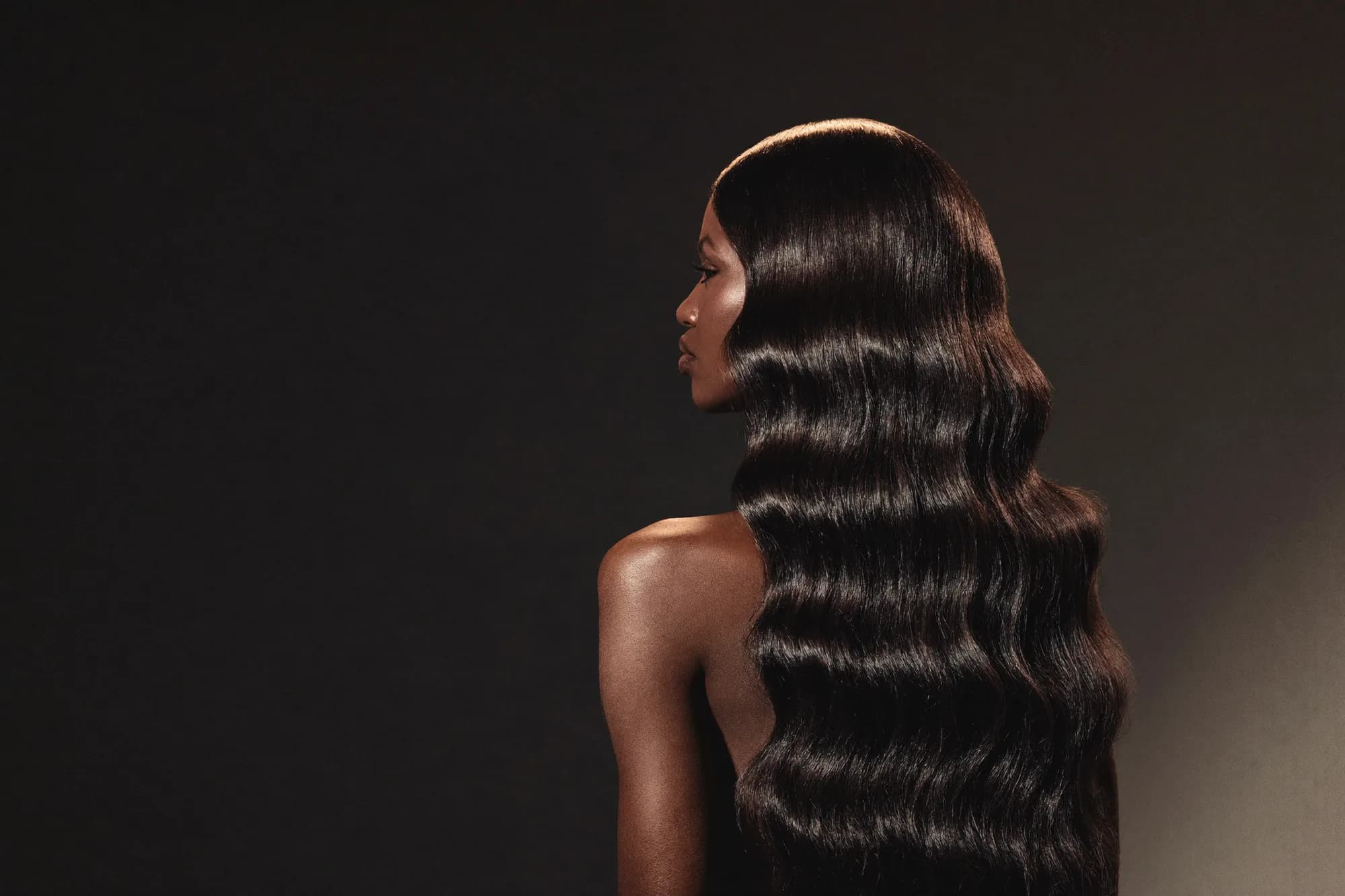 Wari Luxury campaign — long, glossy body-wave hair